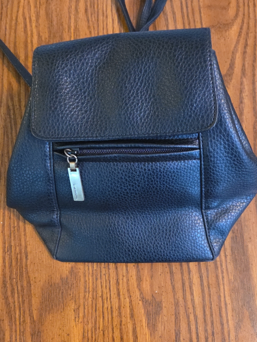 Liz Claiborne black pebbled faux leather mini backpack featuring a front flap